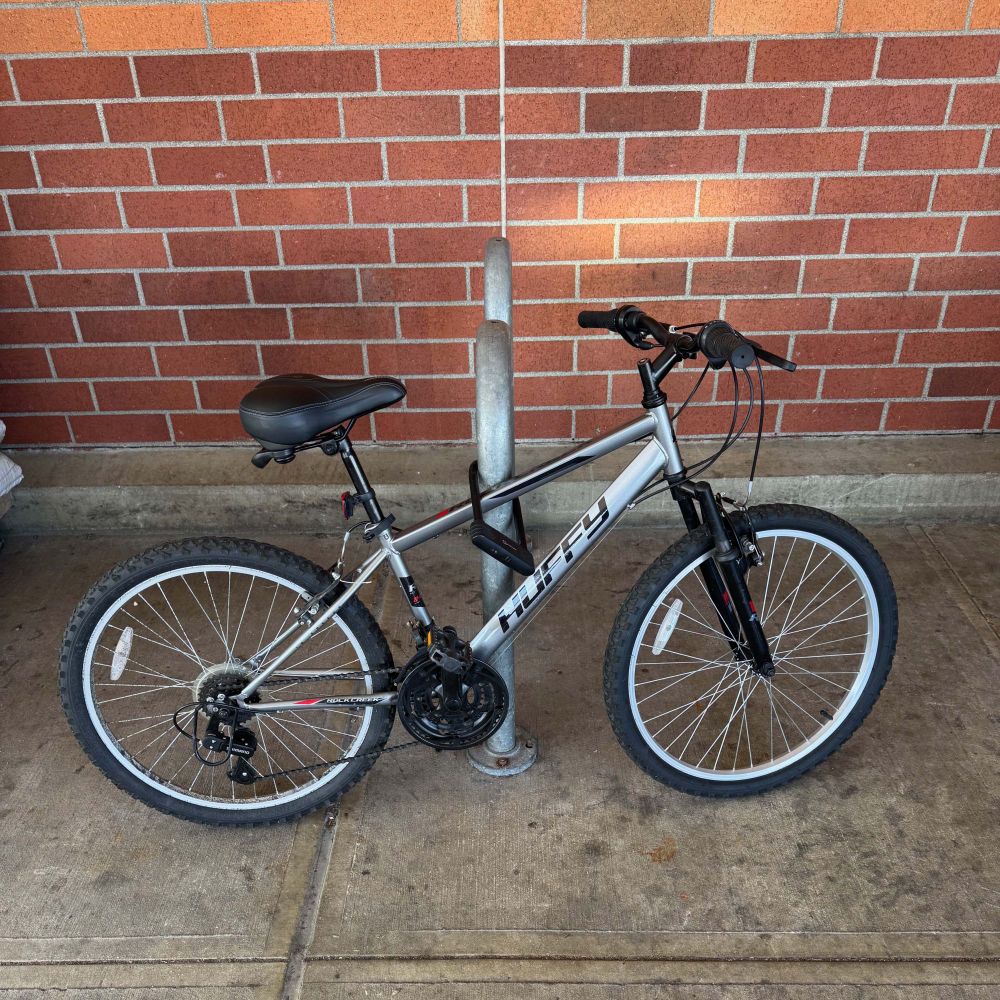 An old-school bike rack at my local grocery store. Someone has parked their bike at the front, and in a manner which makes it nearly impossible for a second or third bike to use the rack. IMO, it needs to be replaced.