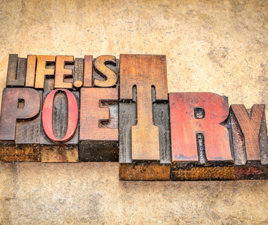 Wooden letter blocks spelling out Life is Poetry
