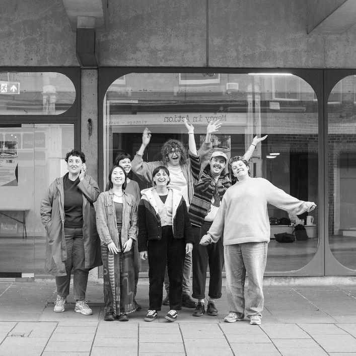 A group of people outside YWMP's new space