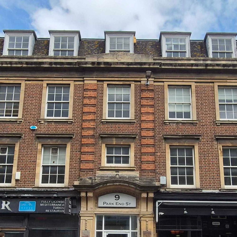 The exterior of a red brick building with a sign that says 9 Park End Street