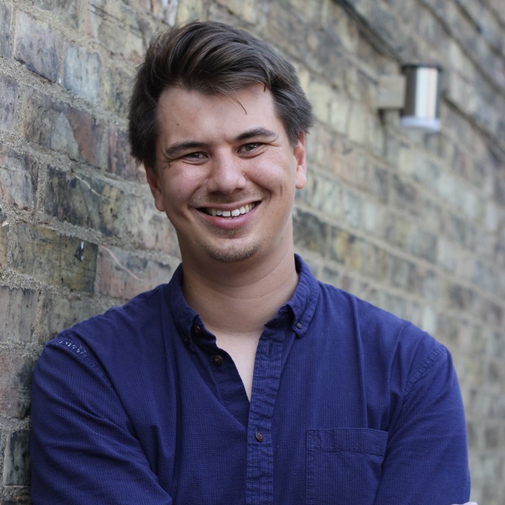 A headshot of Andy Edwards, looking into the camera and smiling