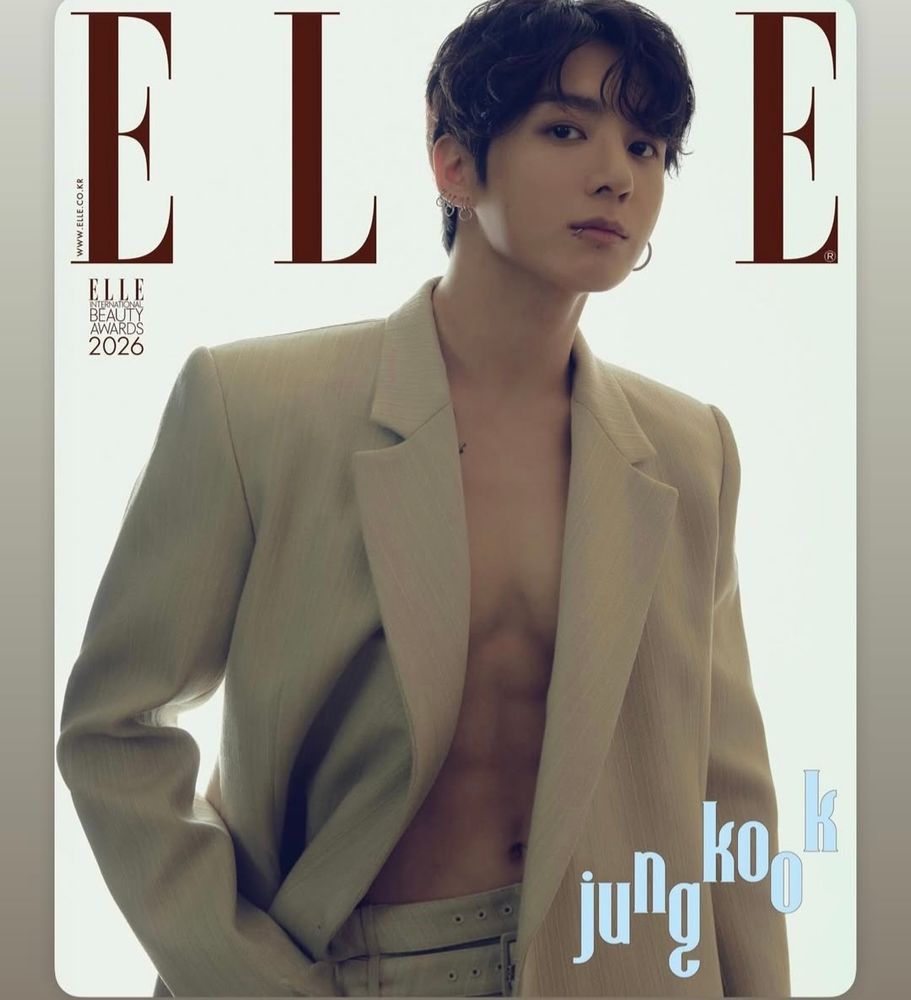 Jungkook in beige jacket and pants. Jacket open, shirtless.
Abs yes.