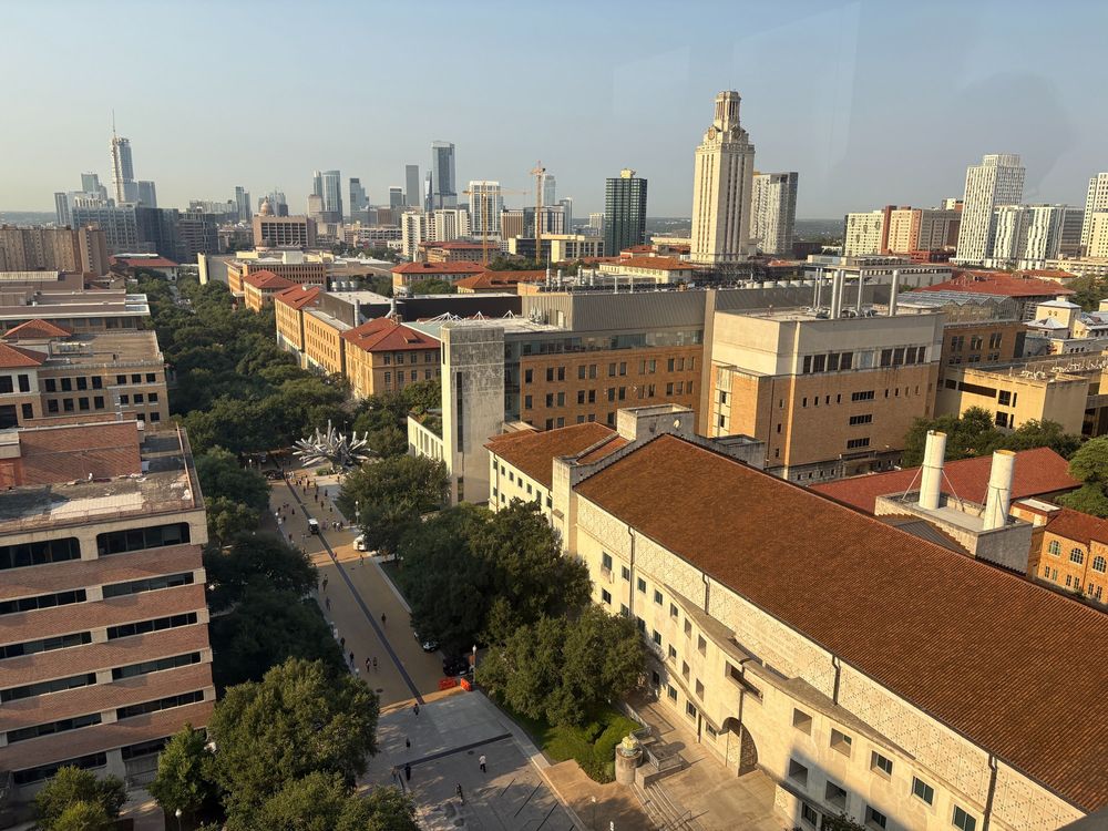 Morning view of the campus of the University of Texas at Austin with the downtown Austin buildings in the distance