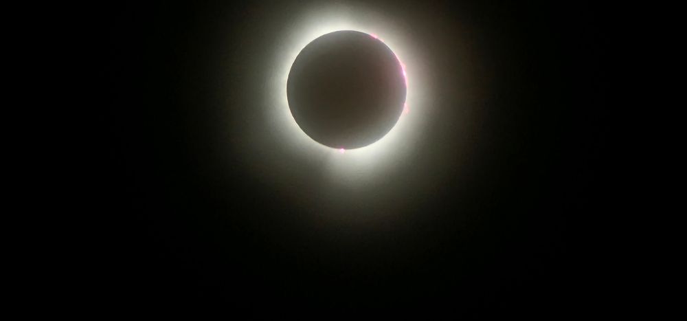 total solar eclipse with bright ring of light surrounding the moon