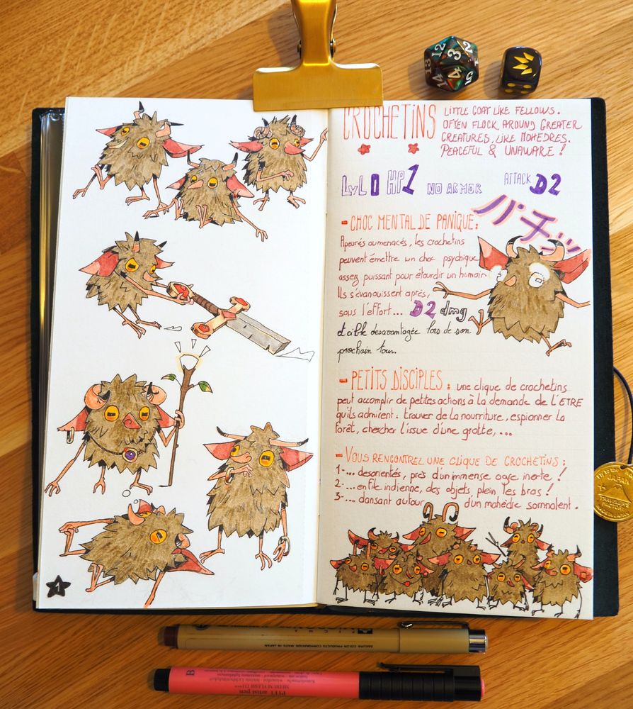 A picture of a notebook. On it, little goat-like creatures are drawn. They're called Crochetins. 