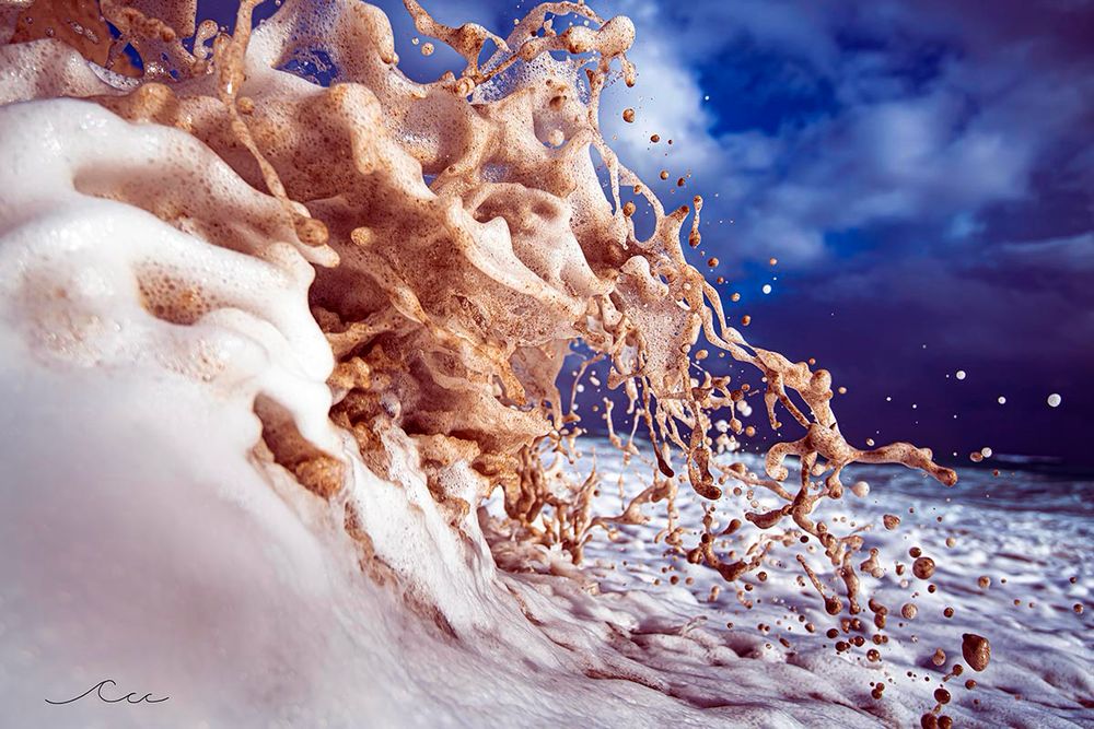 A fast shutter of a wave crashing against the shoreline and heading back out to the ocean