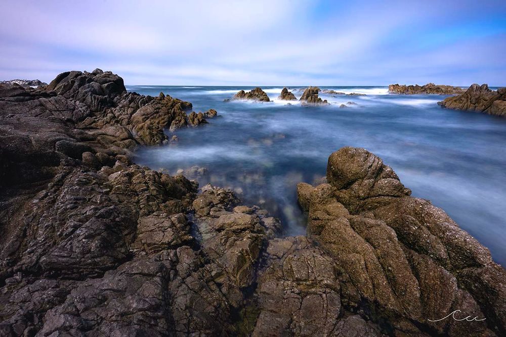 A long exposure of a rocky shoreline in California by Christopher Warren