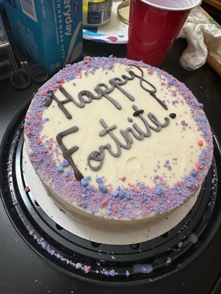 An ice cream cake reading “Happy Fortnite!” on top. 