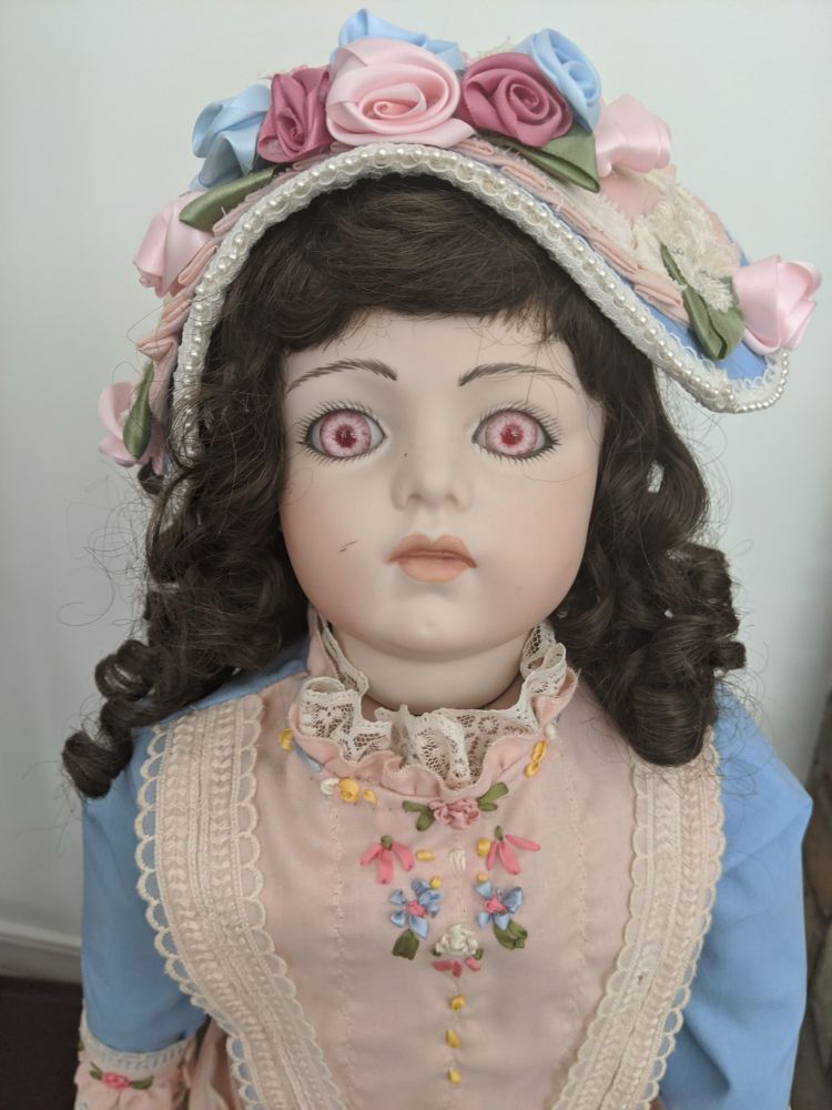 One creepy red-eyed doll