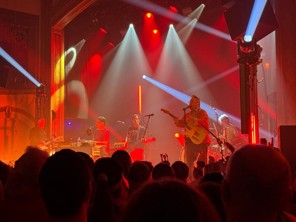A photograph of They Might Be giants playing at the Neptune theatre in Seattle Washington