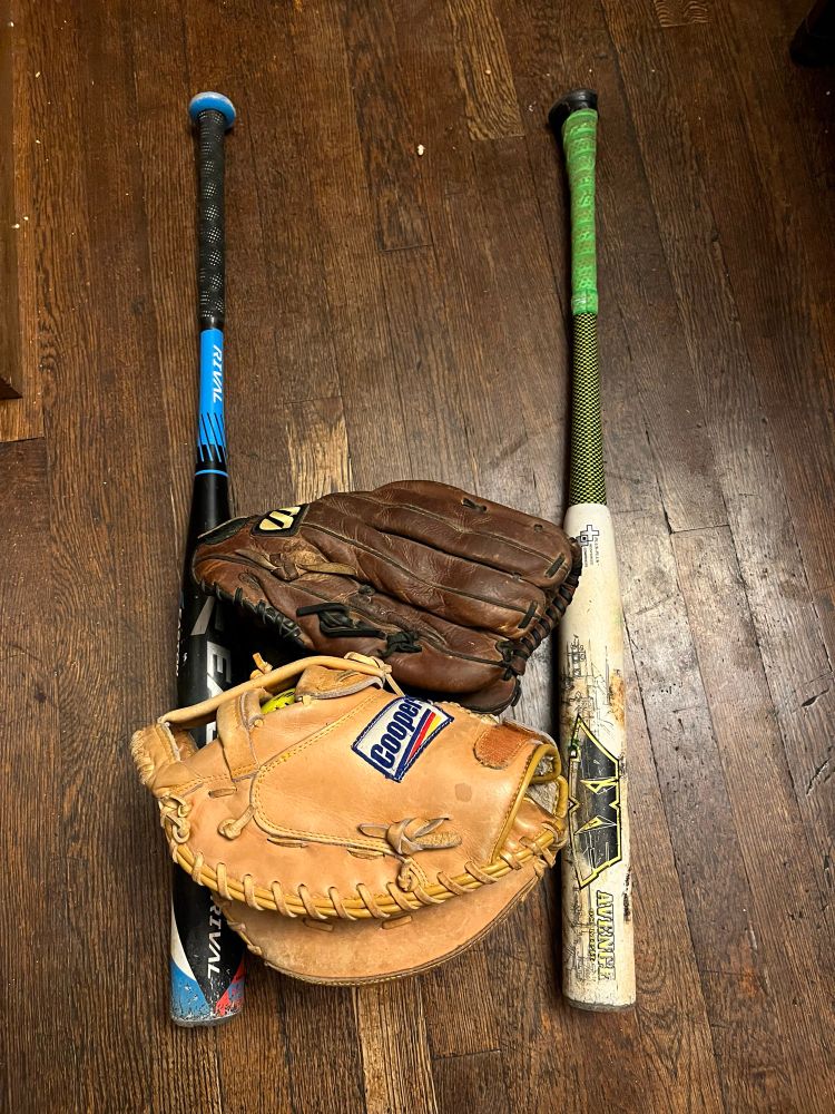 My bats and gloves unpacked from the baseball bag for the winter
