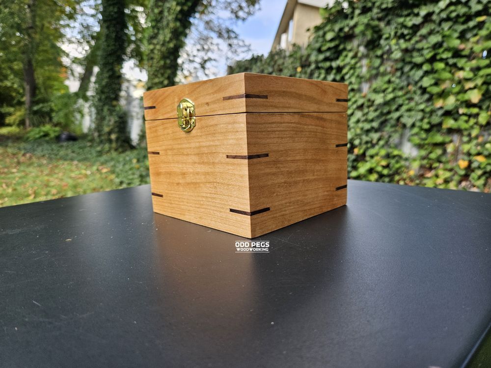 Side view of a cherry and maple gift box