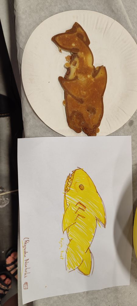 A picture of a shark drawing next to a shark crepe