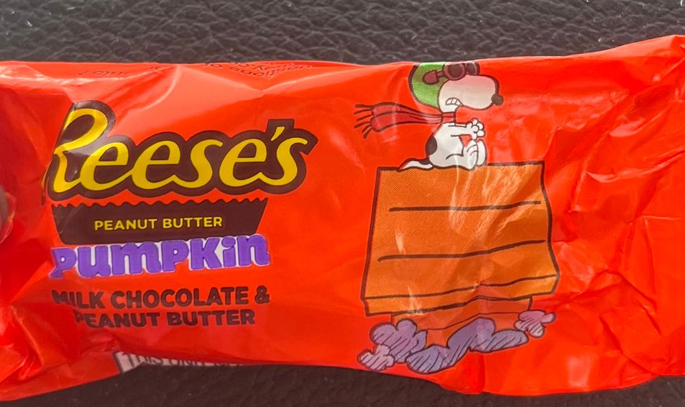 Reese’s with Snoopy on his flying doghouse. 