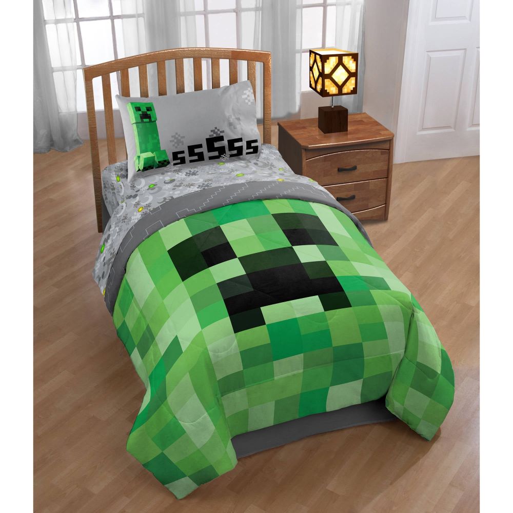 Bed with Minecraft themed bedsheets and pillow