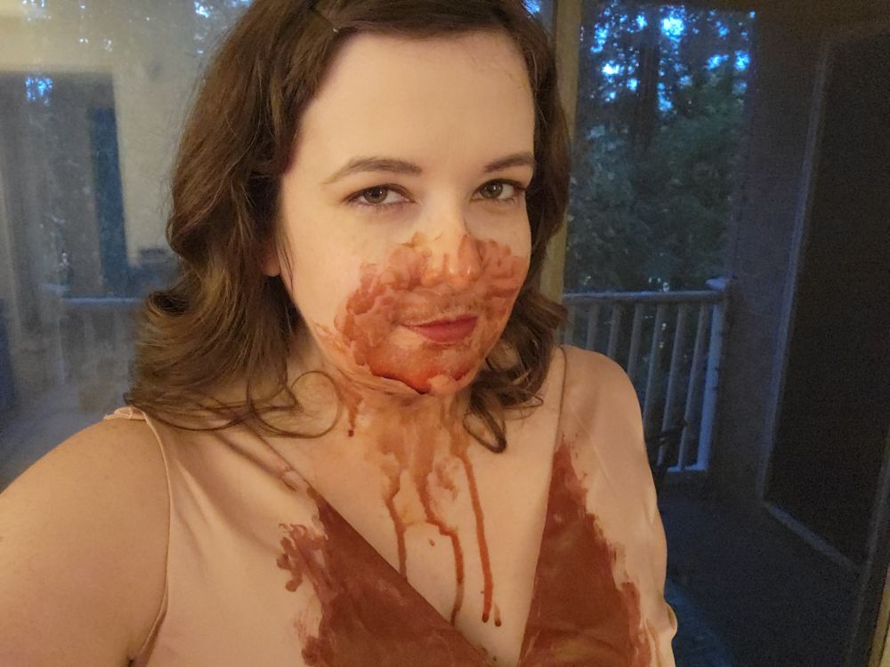 OP dressed as Mary from Sinners, with fake blood all over her face, neck, and chest