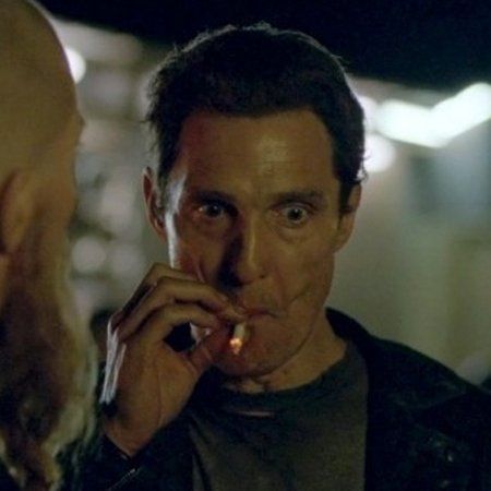 movie still of Matthew McConaughey dramatically sucking on a cigarette with a thousand yard stare.