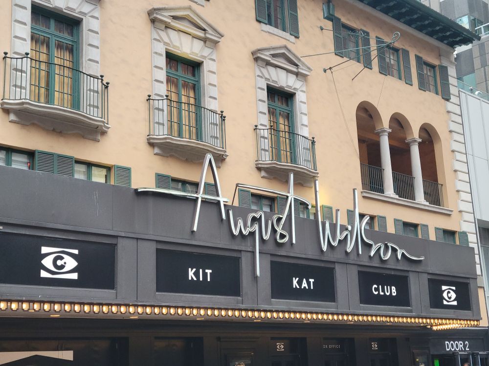 a photo of the front of the August Wilson Theatre in New York City with a marquee showing "Kit Kat Club" aka the Cabaret revival 