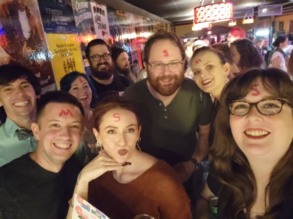 a selfie of several individuals in line for a midnight showing of the rocky horror picture show