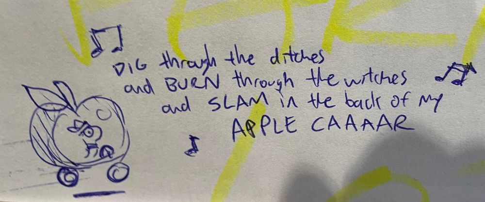 The Lowly Worm drives his signature vehicle next to the bastardized lyrics of “Dragula”: DIG through the ditches and BURN through the witches and SLAM in the back of my APPLE CAAAAR