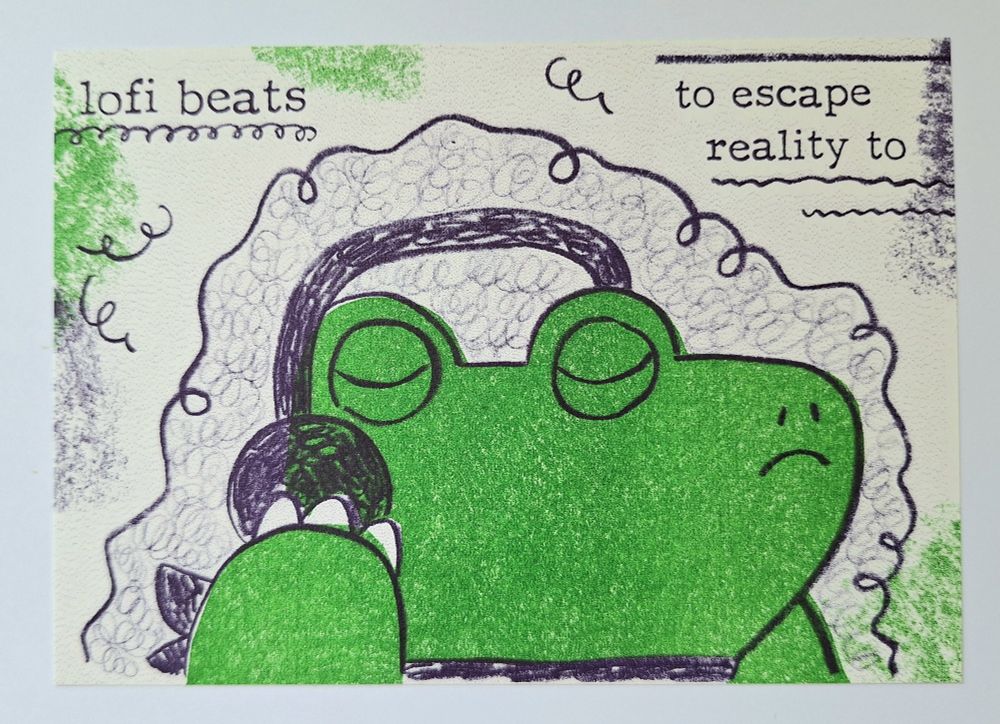 Riso print of a postcard design showing a cartoon crocodile wearing headphones, eyes closed, around them a swirly aura. Above the text "lofi beats to escape reality to". The character's body and some color splotches around are a bright green, the line art, text and swirlies are a deep purple, all on an off white paper.