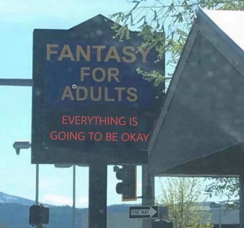 A road sign sign for “FANTASY FOR ADULTS.” The digital banner reads, “Everything is going to be okay.”