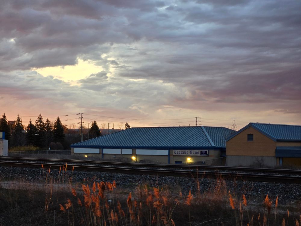 Early sunrise over a train station.