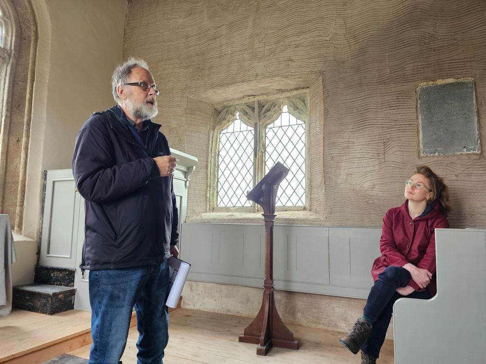 Rachel Morley looks on as Andrew Davidson talks about the history of St Twrog’s church