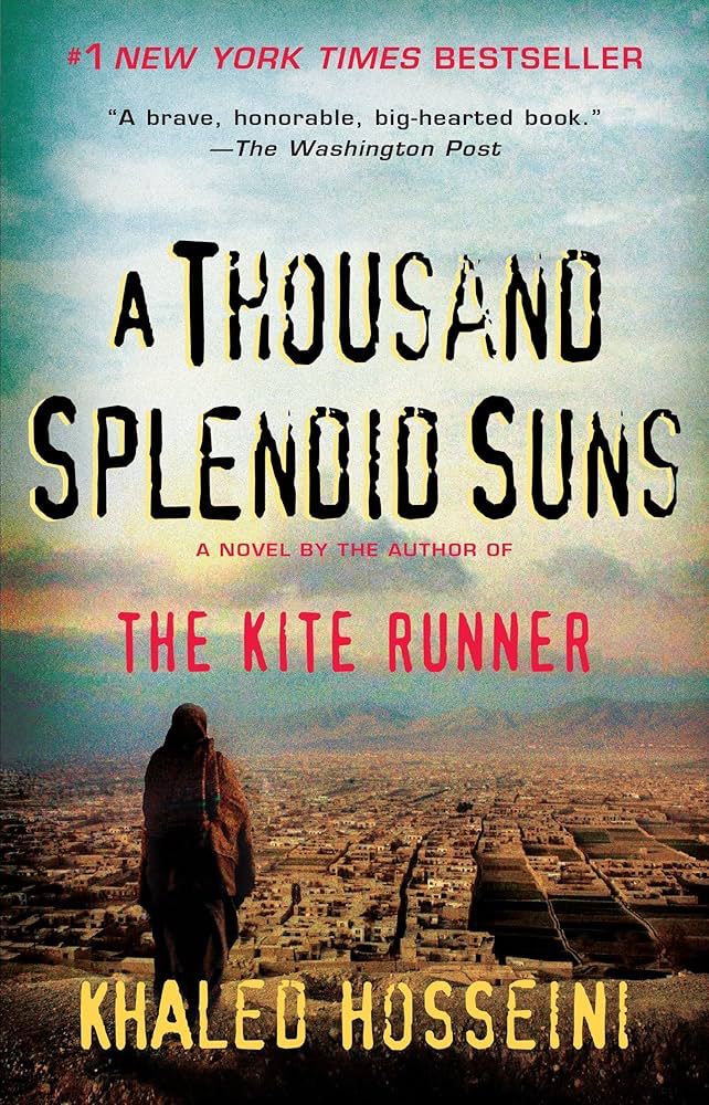 The cover for Khaled Hosseini’s novel A Thousand Splendid Suns. An Afghan woman stands on a mountain overlooking the tops of a city. 