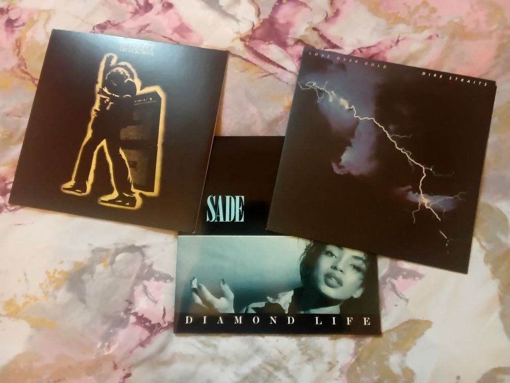3LP covers. Electric Warrior (T. Rex), Diamond Life (Sade), and Love Over Gold (Dire Straits).