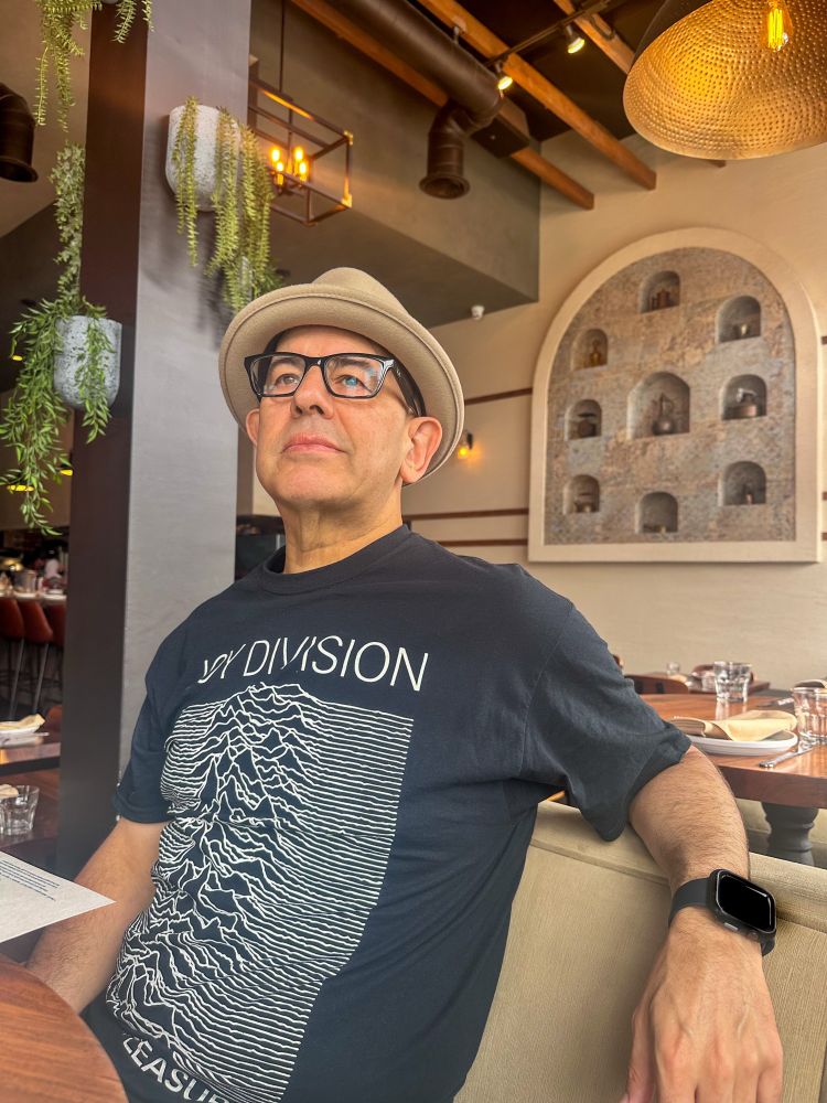 Simon wearing a Joy Division shirt