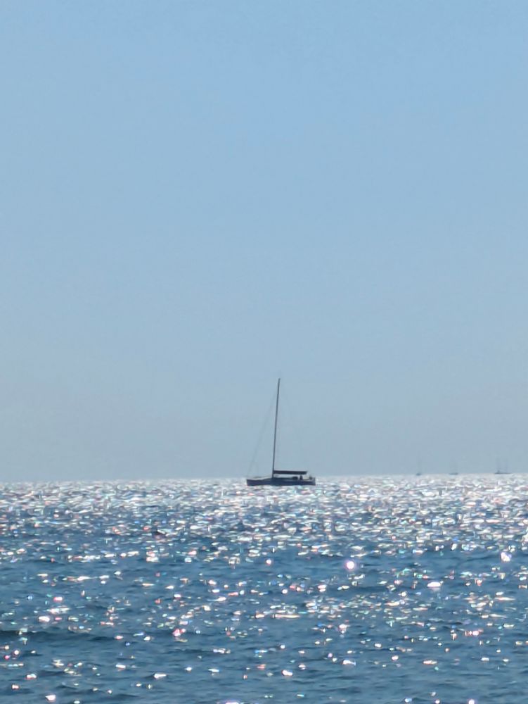Sailboat on sparkling water of Lake Michigan.
