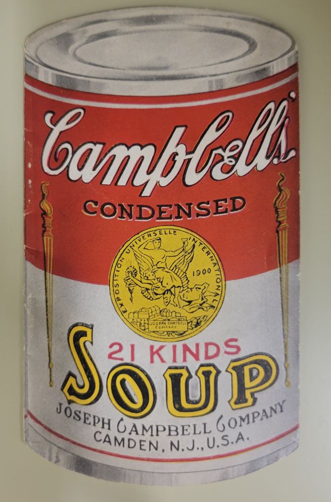 Pamphlet cut in the shape of a Campbell's soup can, colored in red, white, and silver, reading "Campbell's Condensed (21 Kinds) Soup. Joseph Campbell Company, Camden, N.J., U.S.A." 
