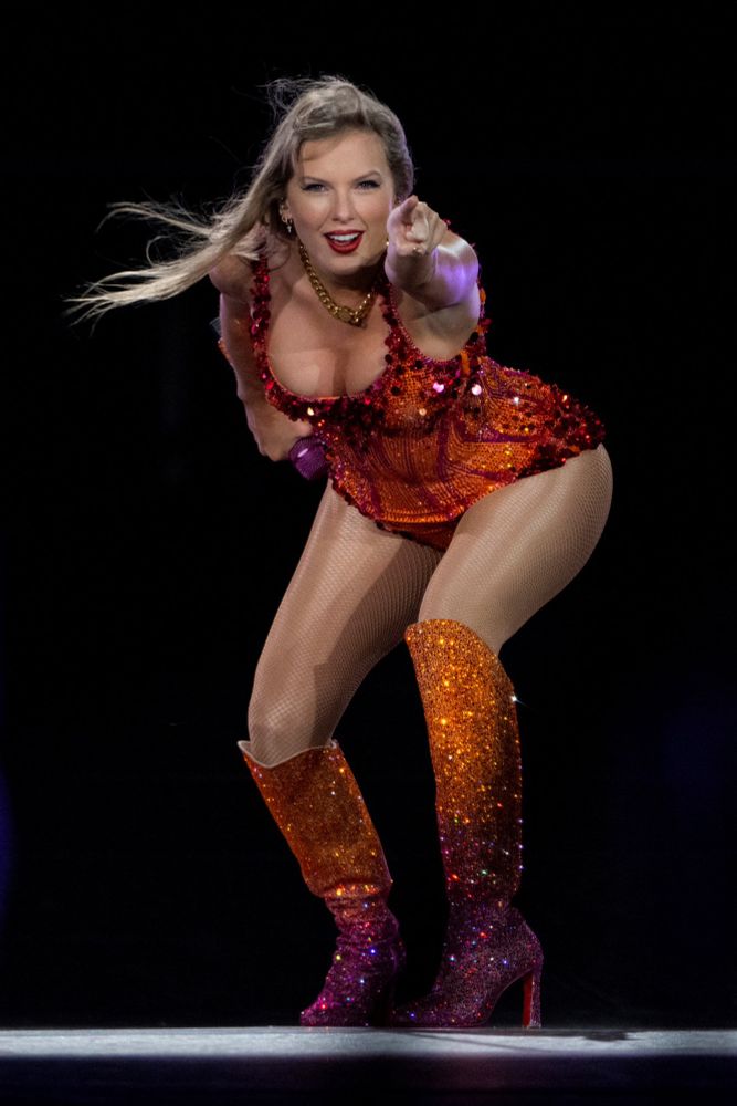 taylor swift in tangerine orange and pink lover bodysuit at the eras tour