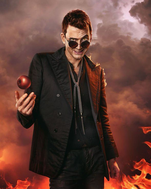 Crowley holding an apple