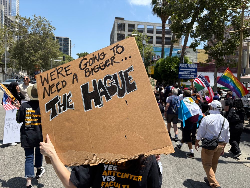 Protest sign: “We’re going to need a bigger The Hague”