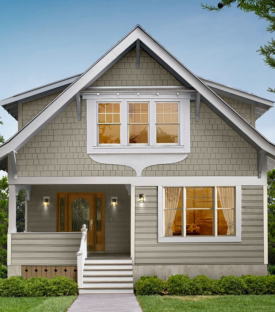 Grey, 2-story house with front porch and 6 steps to reach the front door.