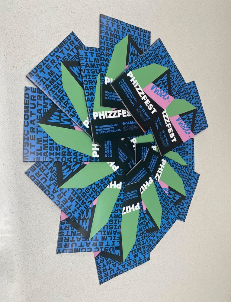 Display of programmes for Phizzfest Arts & Community Festival 