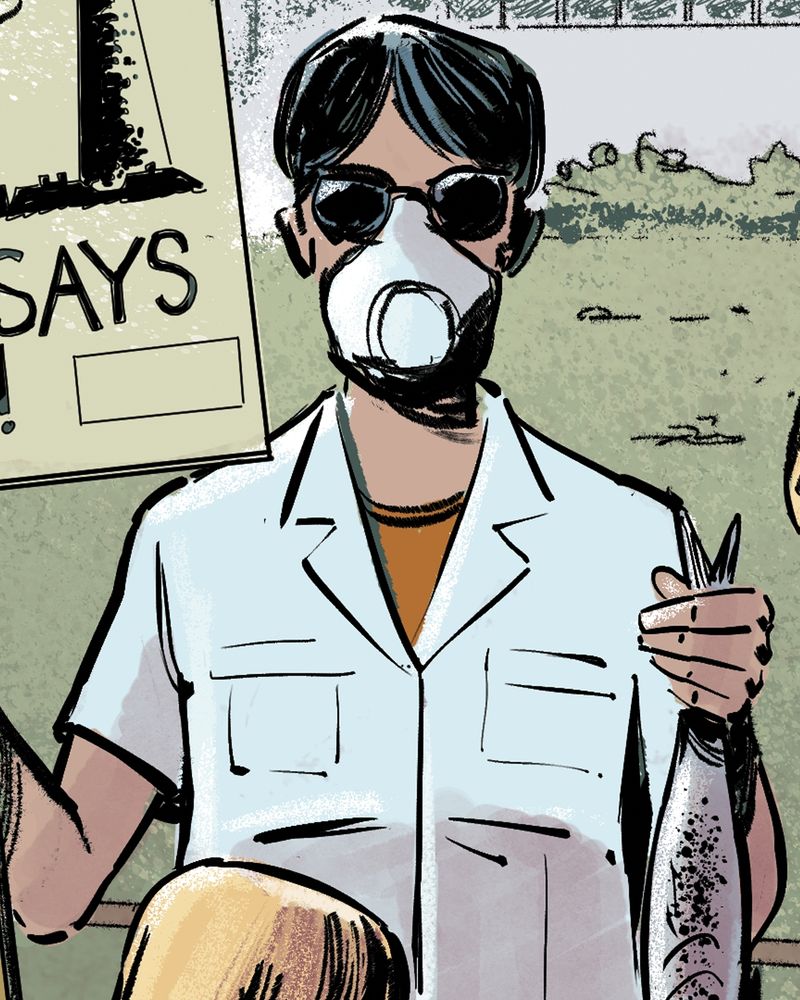 Detail from an illustration showing a woman in a protective face mask holding a dead fish and placard. She is protesting against a local factory which is polluting the area.