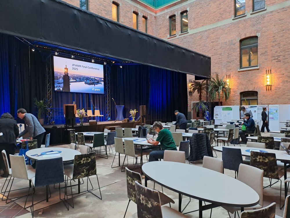 View of conference hall with announcement screen: jpiamr final conference 2025