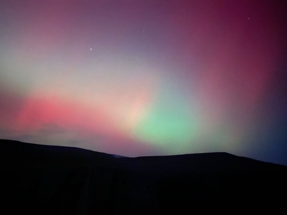 Long exposure of a bright multicolored aurora borealis