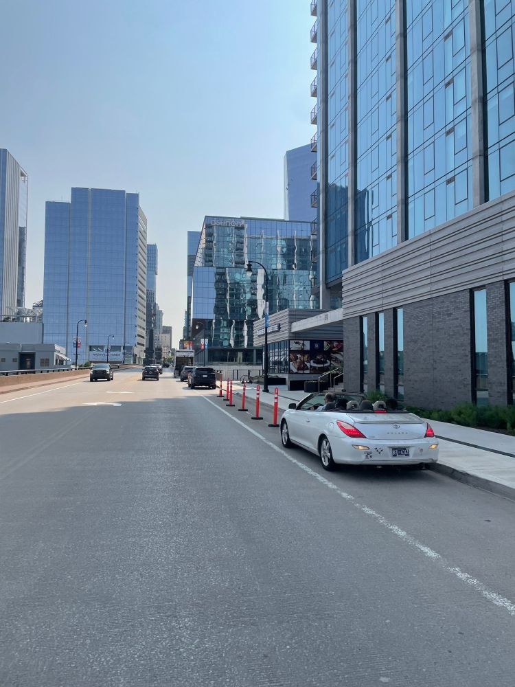 Cars and trucks parked in a bike lane