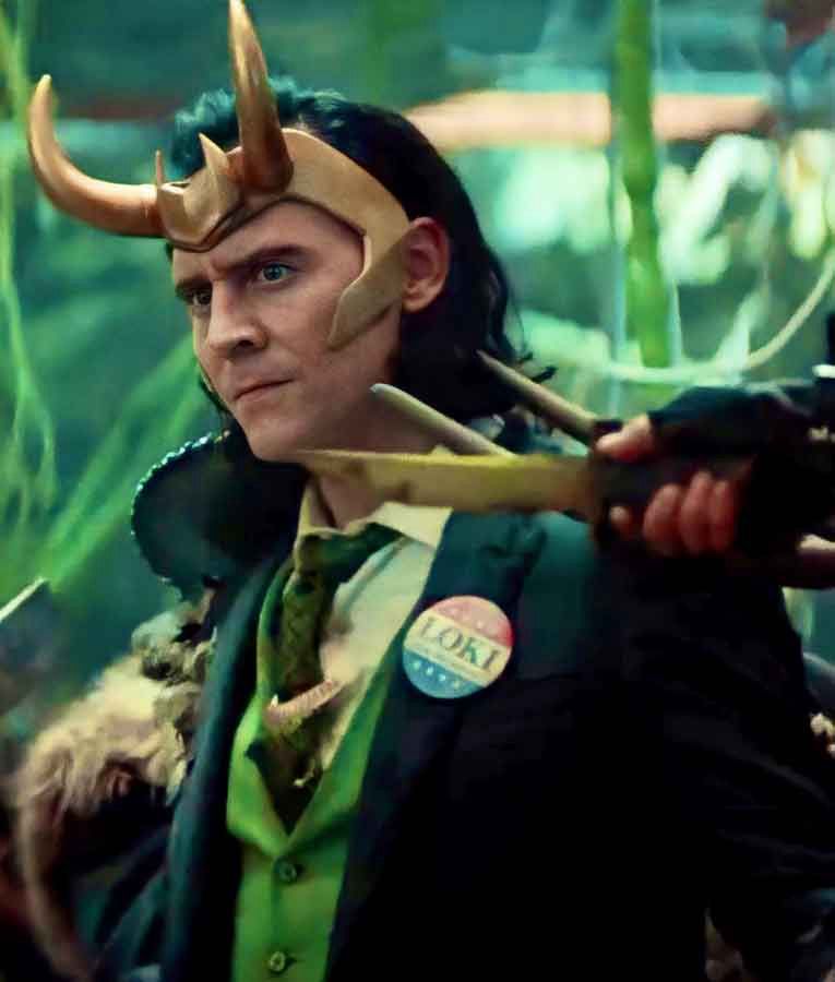 Loki from the Disney Plus Marvel TV show of the same name, dressed in an expensive suit and wearing a pin that reads “Loki for President”.