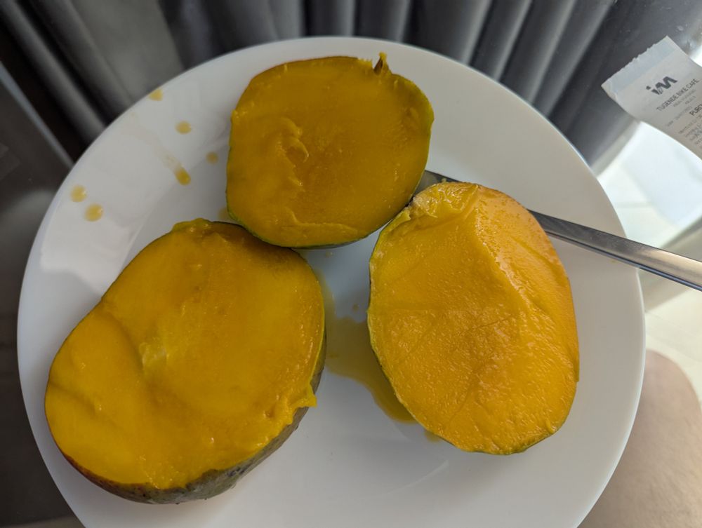 A juicy, cut -up mango ready to be eaten.