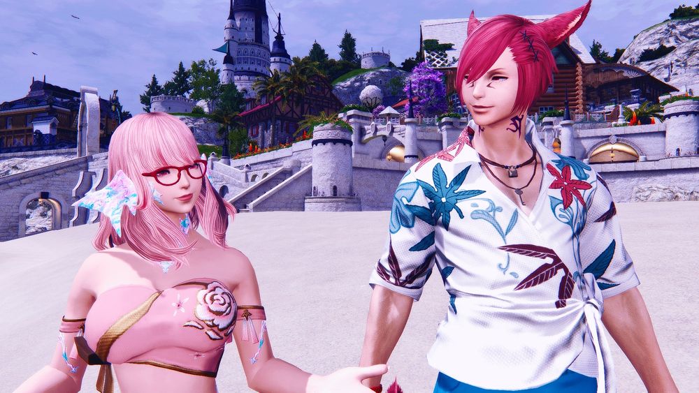 Inomi and Raha in their swimwear. Inomi is speaking with Gale (off camera) while Raha glances at her with a warm smile. They're both standing on the beach in Mist.