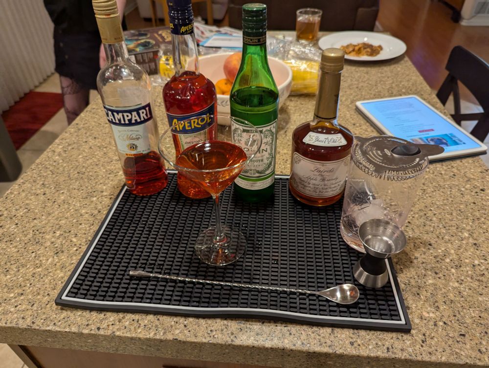 Aperol, campari, dry vermouth, apple brandy 