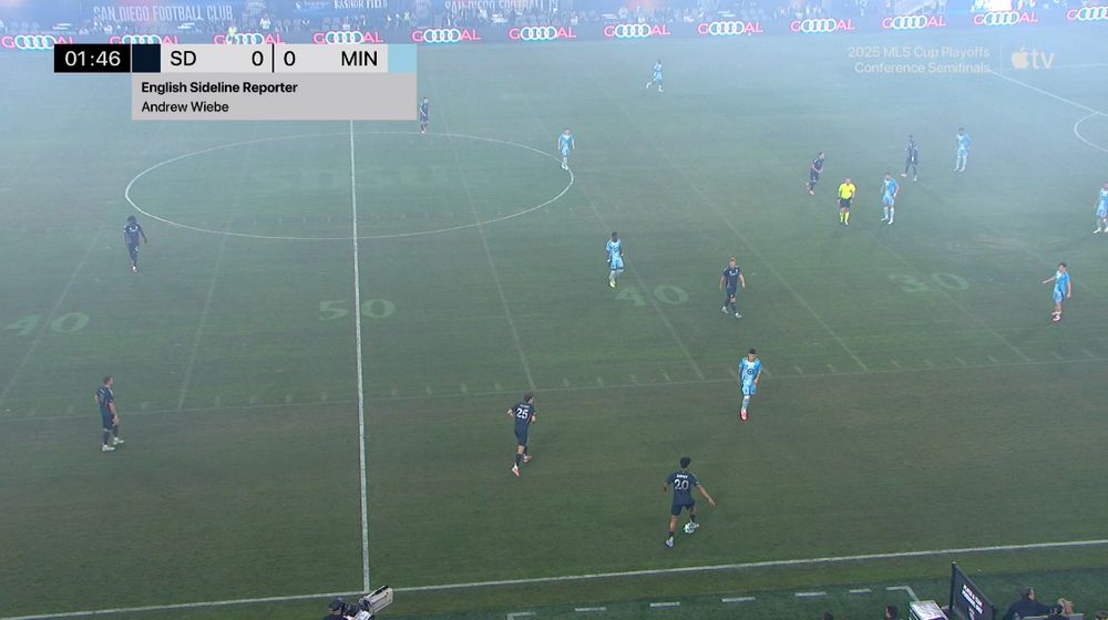 pitch is covered in smoke and the college football striping is still visible