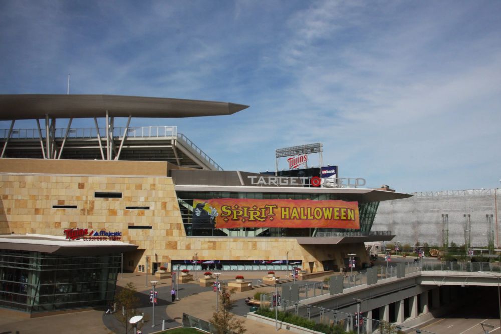 Shot of the outside of Target Field showing the main gate and team store over to the patio area, a Spirit Halloween banner has been added over the glass windows of the club level by me