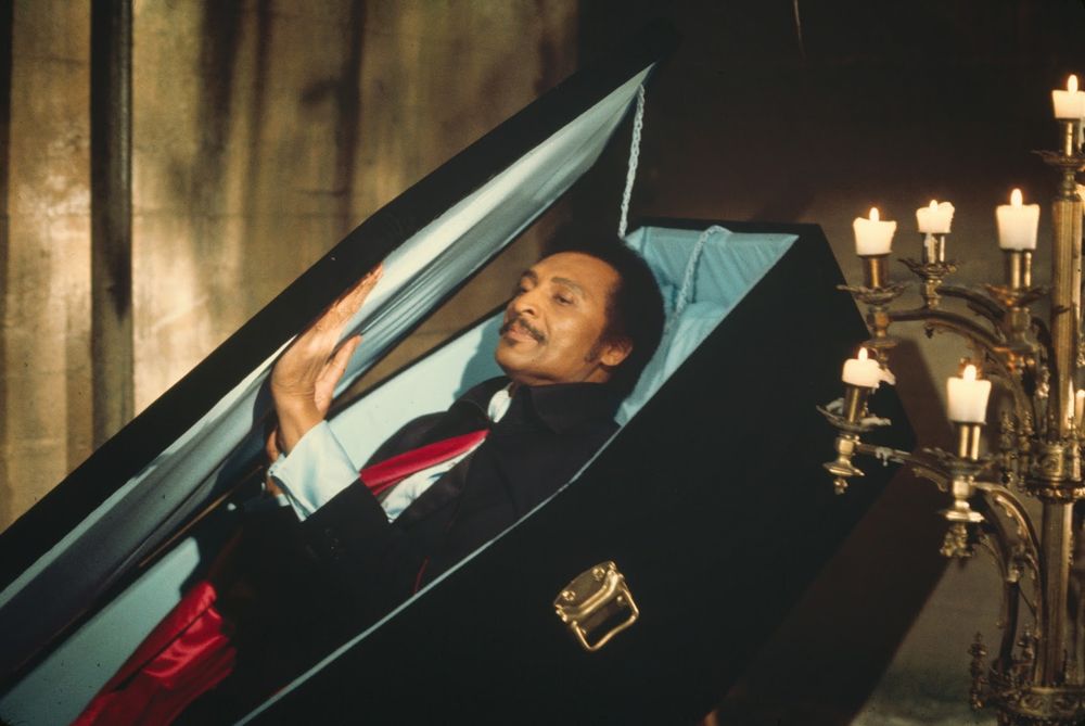 A bad badasssss Blacula emerging from his minty green silk lined coffin