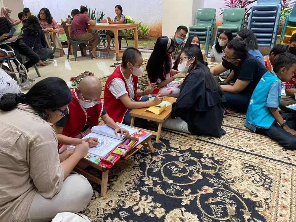 Group sitting on the floor doing an activity together